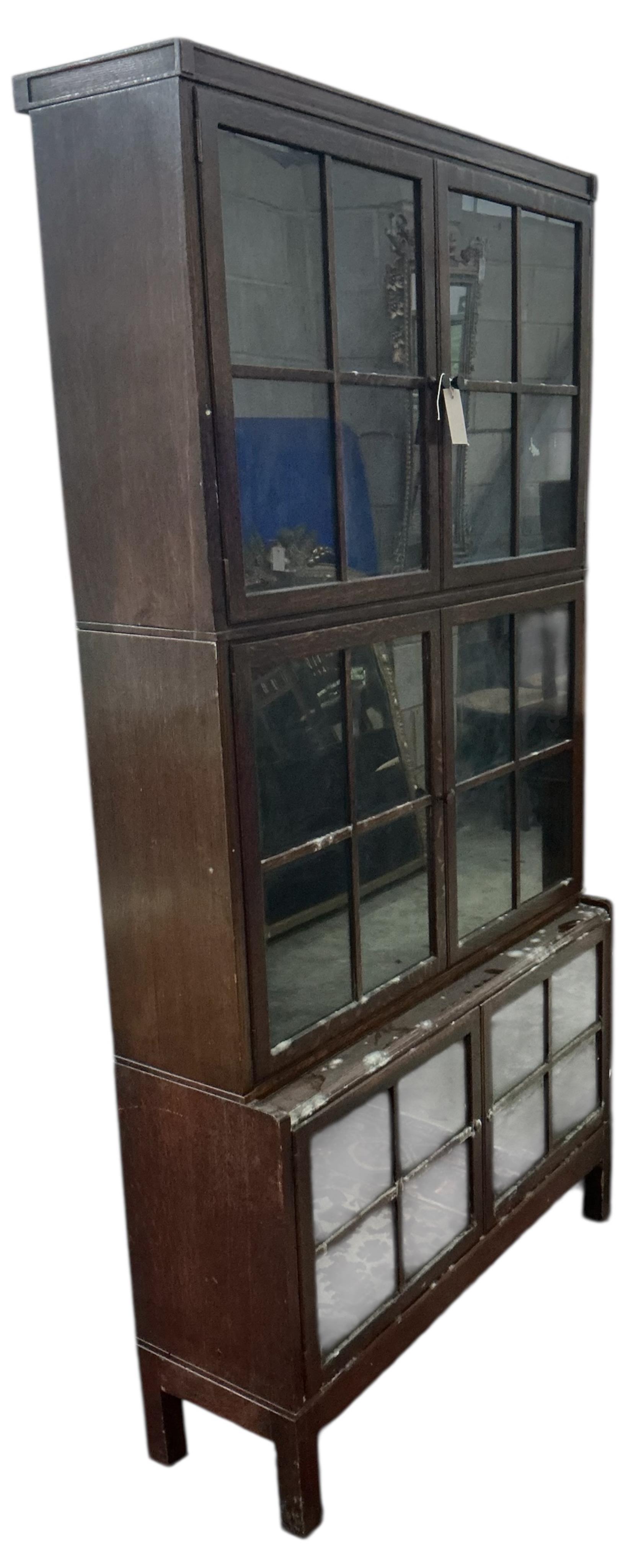 An early 20th century oak bookcase, width 88cm, depth 29cm, height 174cm